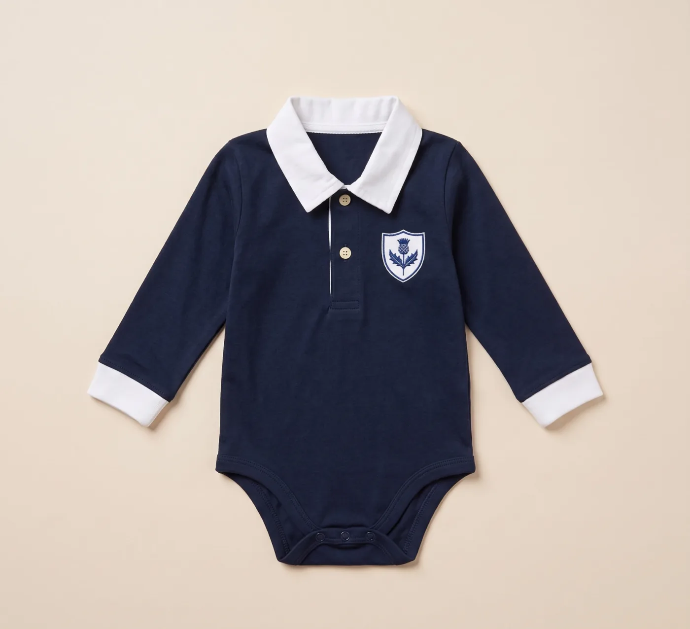 Scotland baby rugby romper in midnight navy with a white collar and thistle crest