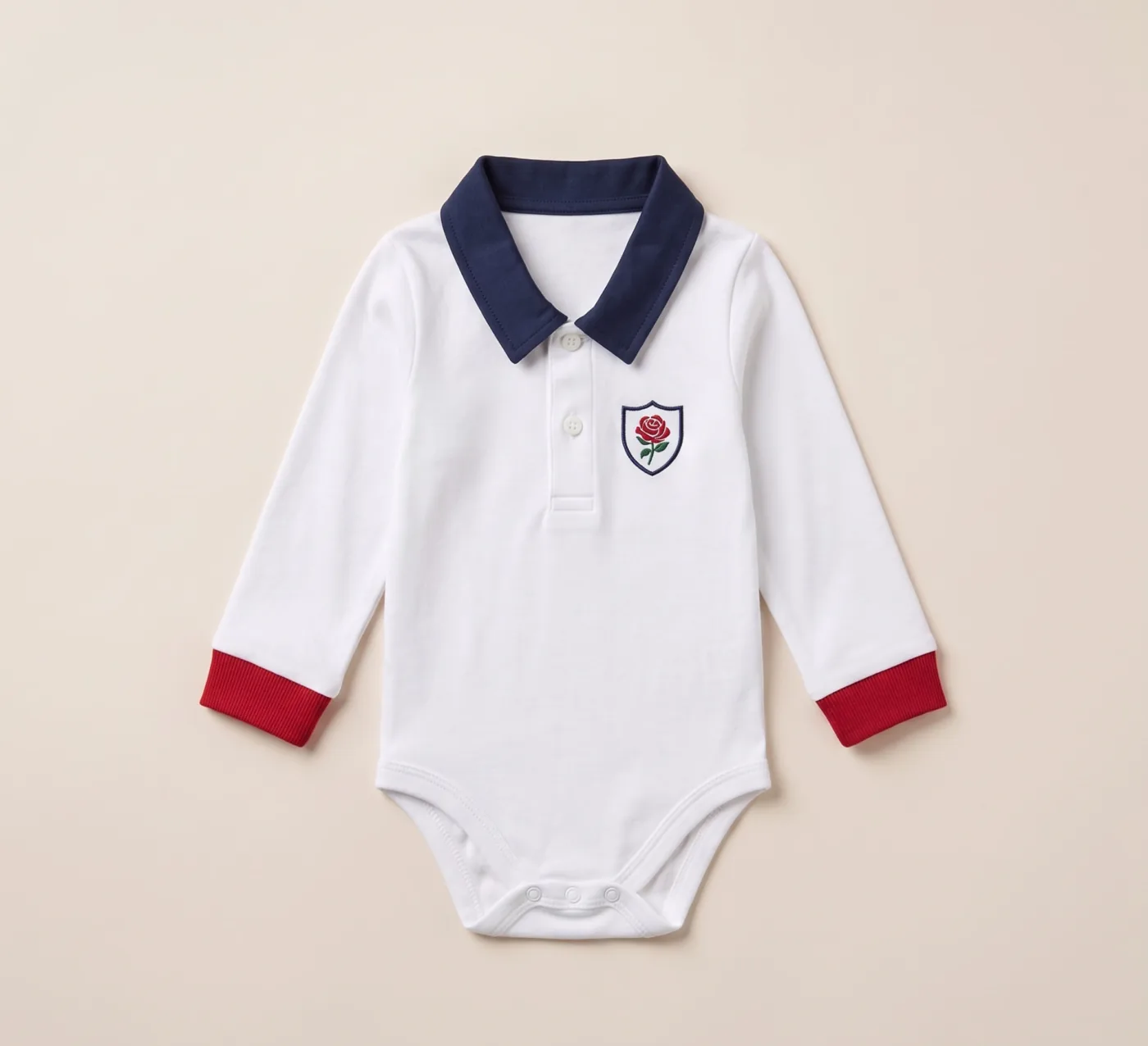 England baby rugby romper in white with a navy collar and rose crest